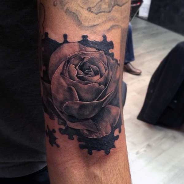 Awesome Rose Puzzle Tattoo On Biceps