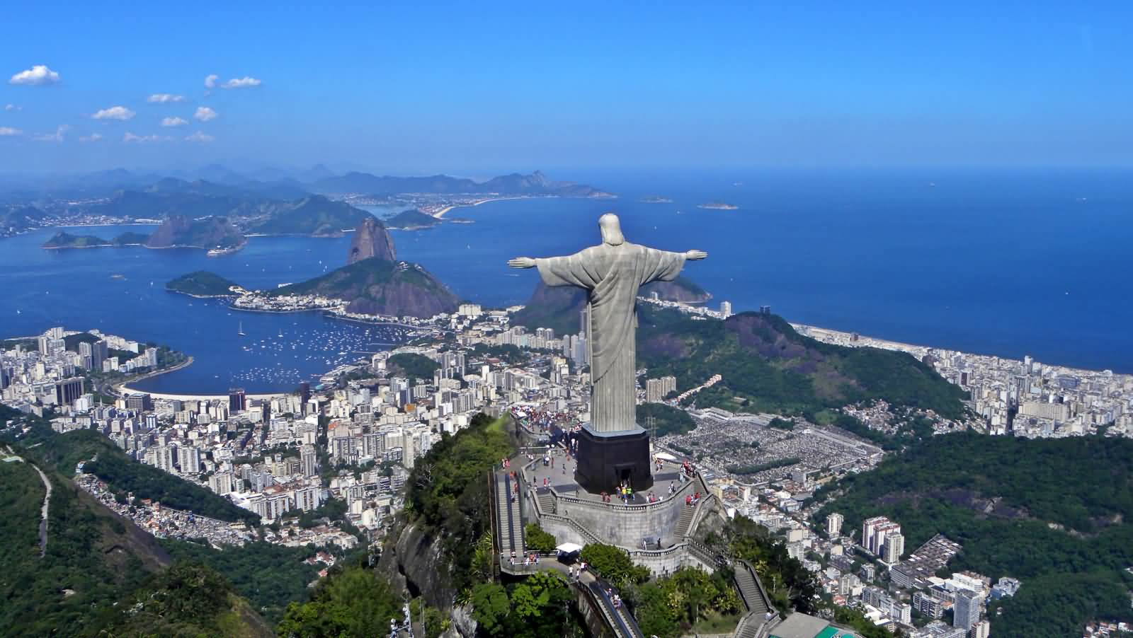 Back View Of Christ the Redeemer Statue At The Top Of Corcovado Mountain In Brazil