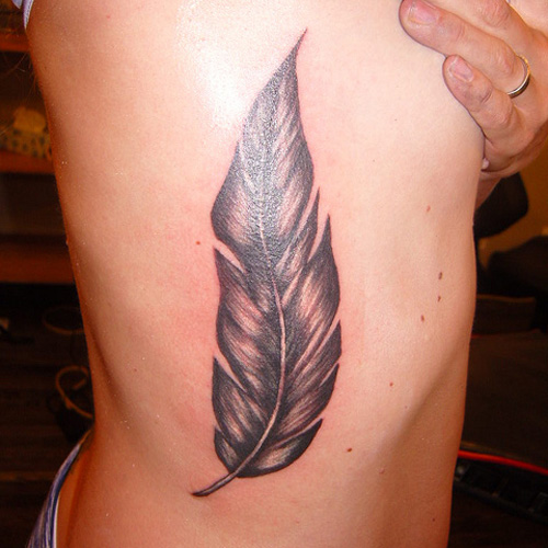 Big Feather Tattoo On Rib Cage