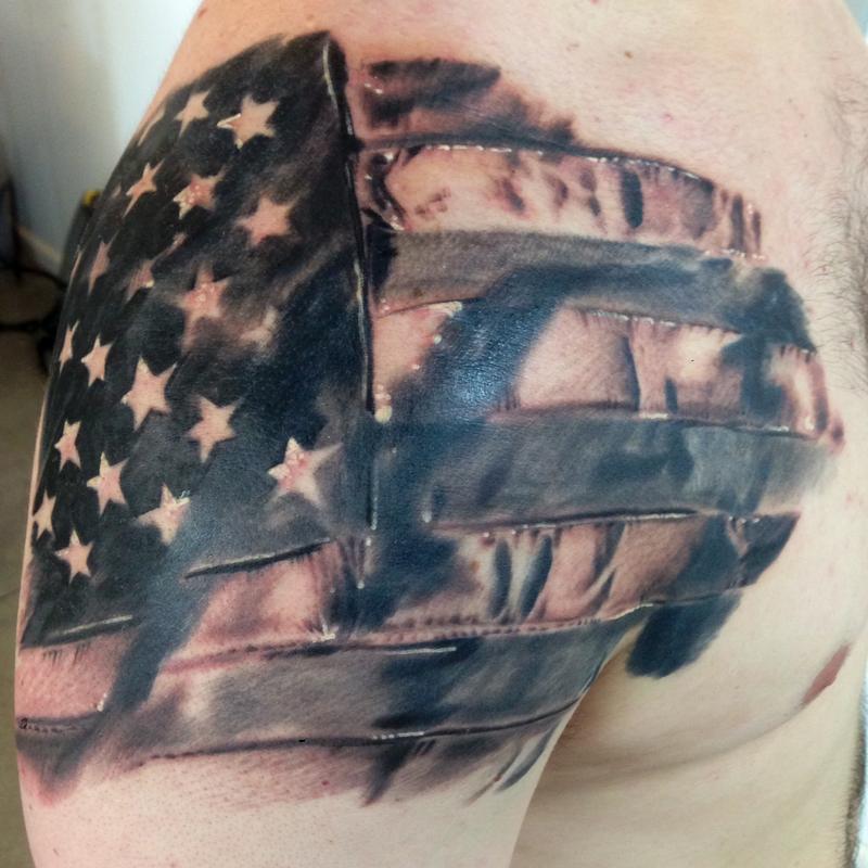 Black And Grey America Flag Tattoo On Right Shoulder