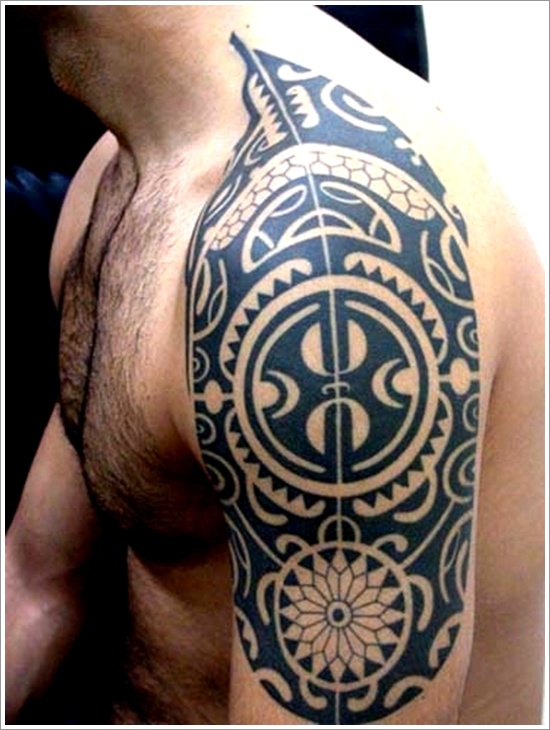Black Maori Tattoo On Man Upper Arm