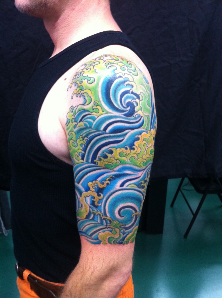 Blue And Green Water Tattoo On Half Sleeve