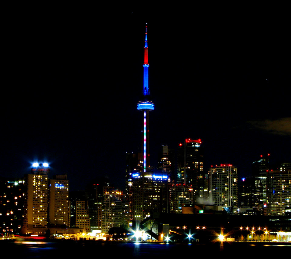 Blue And Red Lights On CN Tower At Night