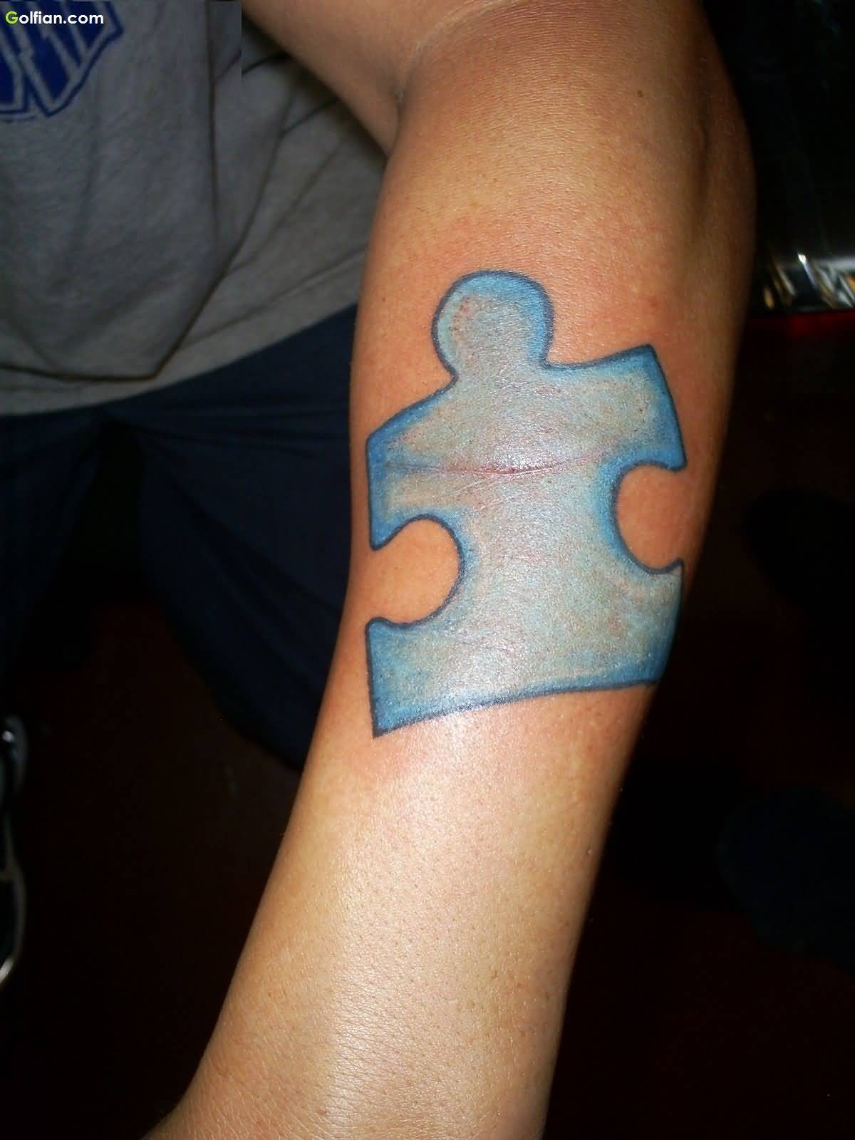Blue Puzzle Tattoo On Arm Sleeve