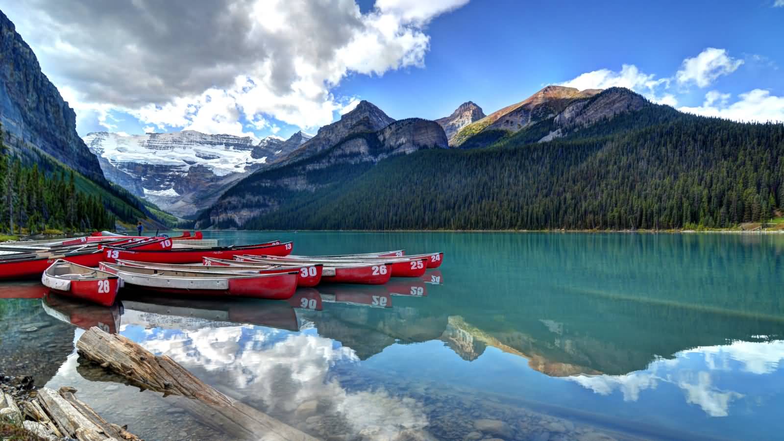 Boats Parked On The Bank Of Lake Louise