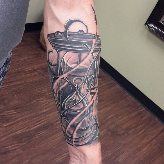 Brilliant Time Is Flying Hourglass Tattoo On Forearm