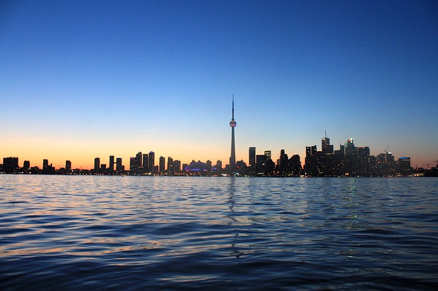 CN Tower And Toronto Skyline View Across The Ontario River