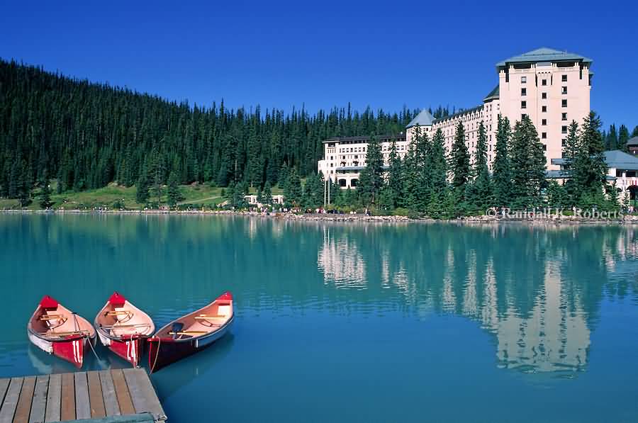 Canoes Wait For Tourists Near The Chateau Lake Louise