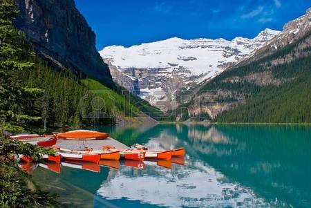 Canoes Waiting For Canoeist At Lake Louise