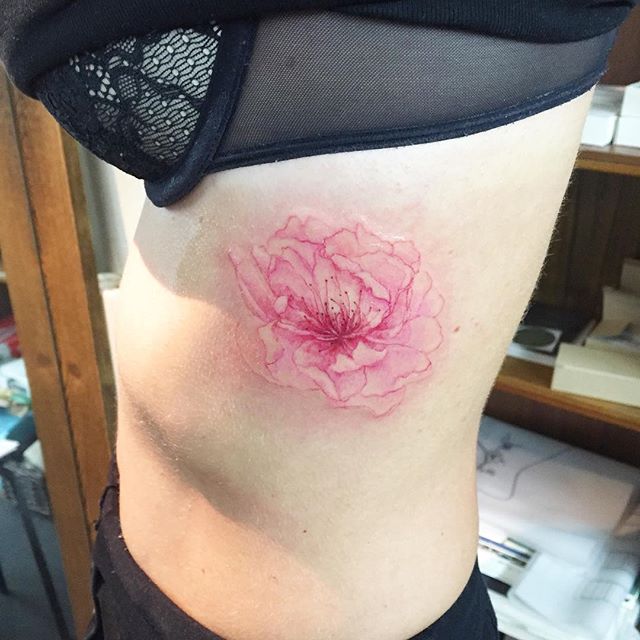 Cherry Blossom Flower Tattoo On Girl Rib Cage