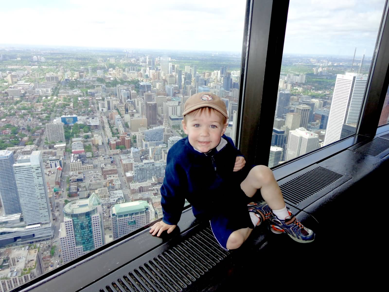 Child Posing For Photograph Inside The CN Tower