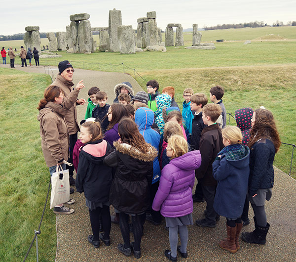 Children At Stonehenge With Explorer Backpacks