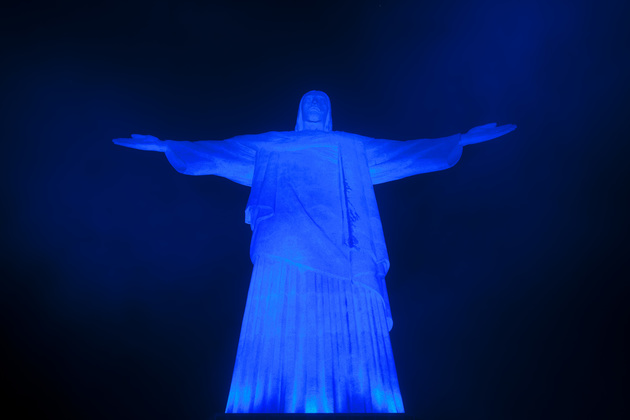 Christ the Redeemer Statue Is Lit Up In Blue At Night