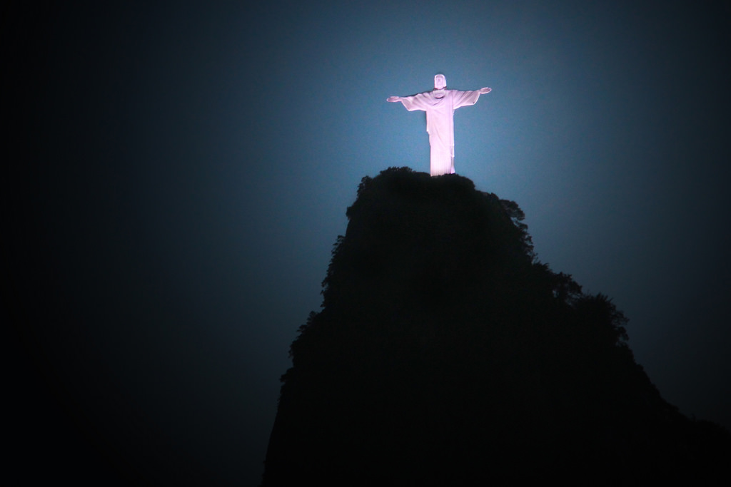 Christ the Redeemer Statue On Crocovado Mountain Lit Up At Night