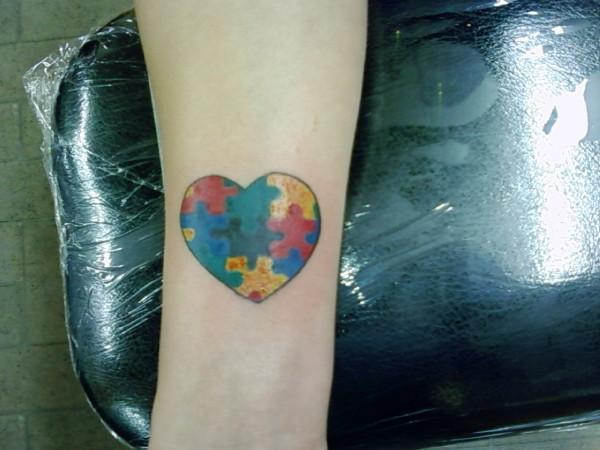 Colorful Heart Puzzle Tattoo On Wrist
