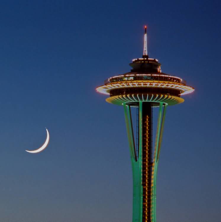 Colorful Lights On Space Needle With Half Moon