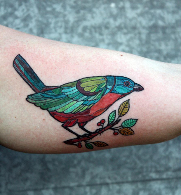 Colorful Stained Glass Bird Tattoo On Biceps