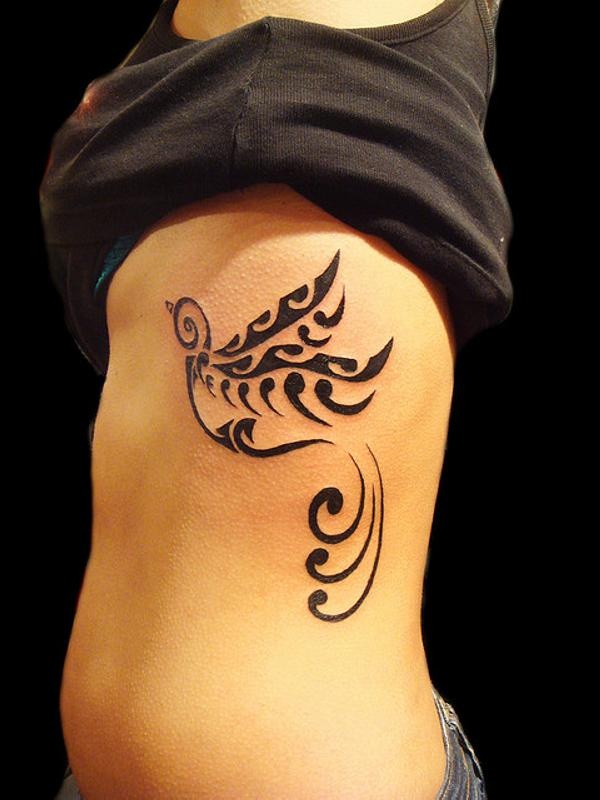 Cool Tribal Bird Tattoo On Rib Cage For Girls