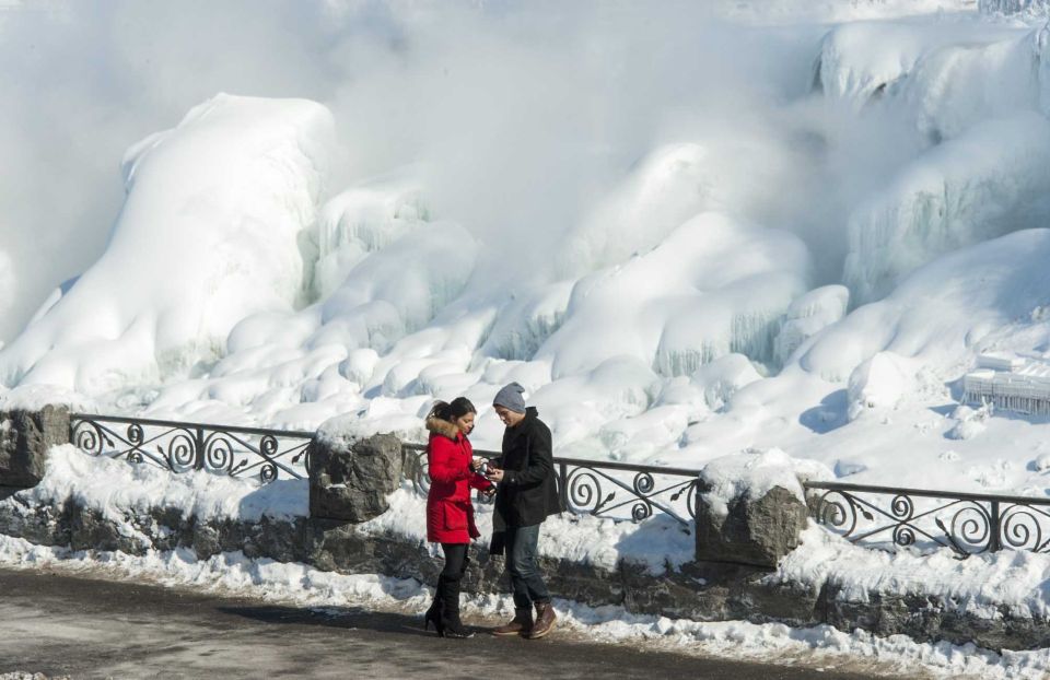 Couple In Front Of Frozen Niagara Falls