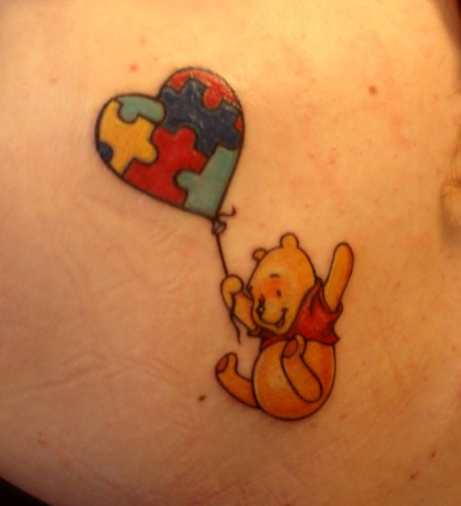 Cute Flying Pooh With Puzzle Heart Balloon Tattoo