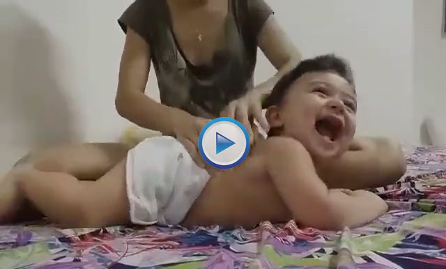 Cute baby enjoying massage Video