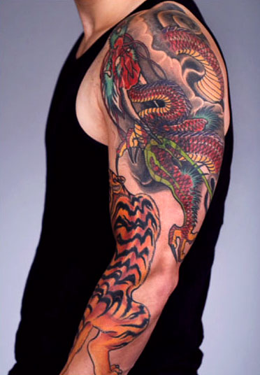 Dragon And Tiger Tattoo On Man Left Sleeve by Chris Nunez