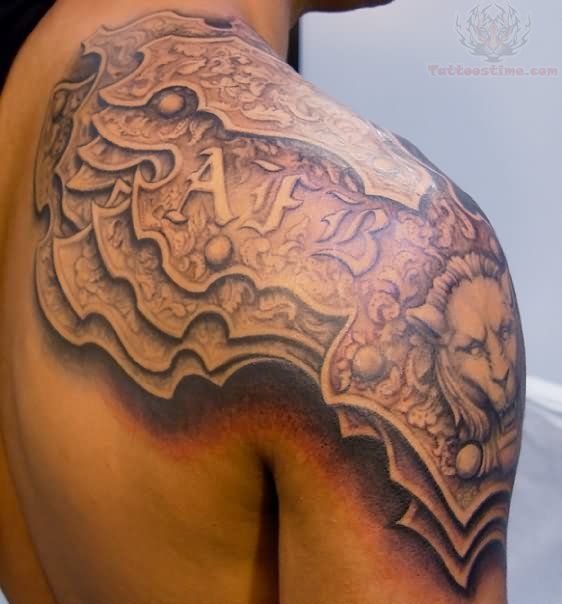 Fantastic Leather Armor Tattoo On Upper Shoulder