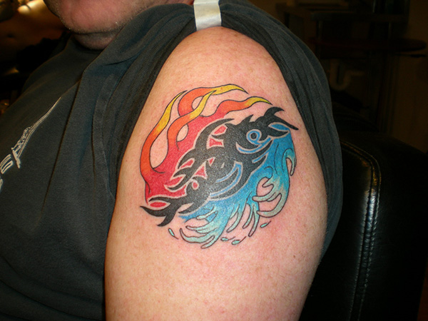 Fire Water With Tribal Design Tattoo On Left Shoulder