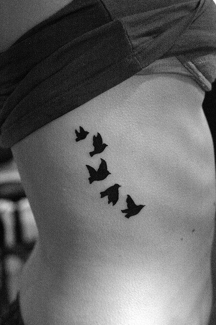 Flying Birds Silhouette Tattoo On Rib Cage