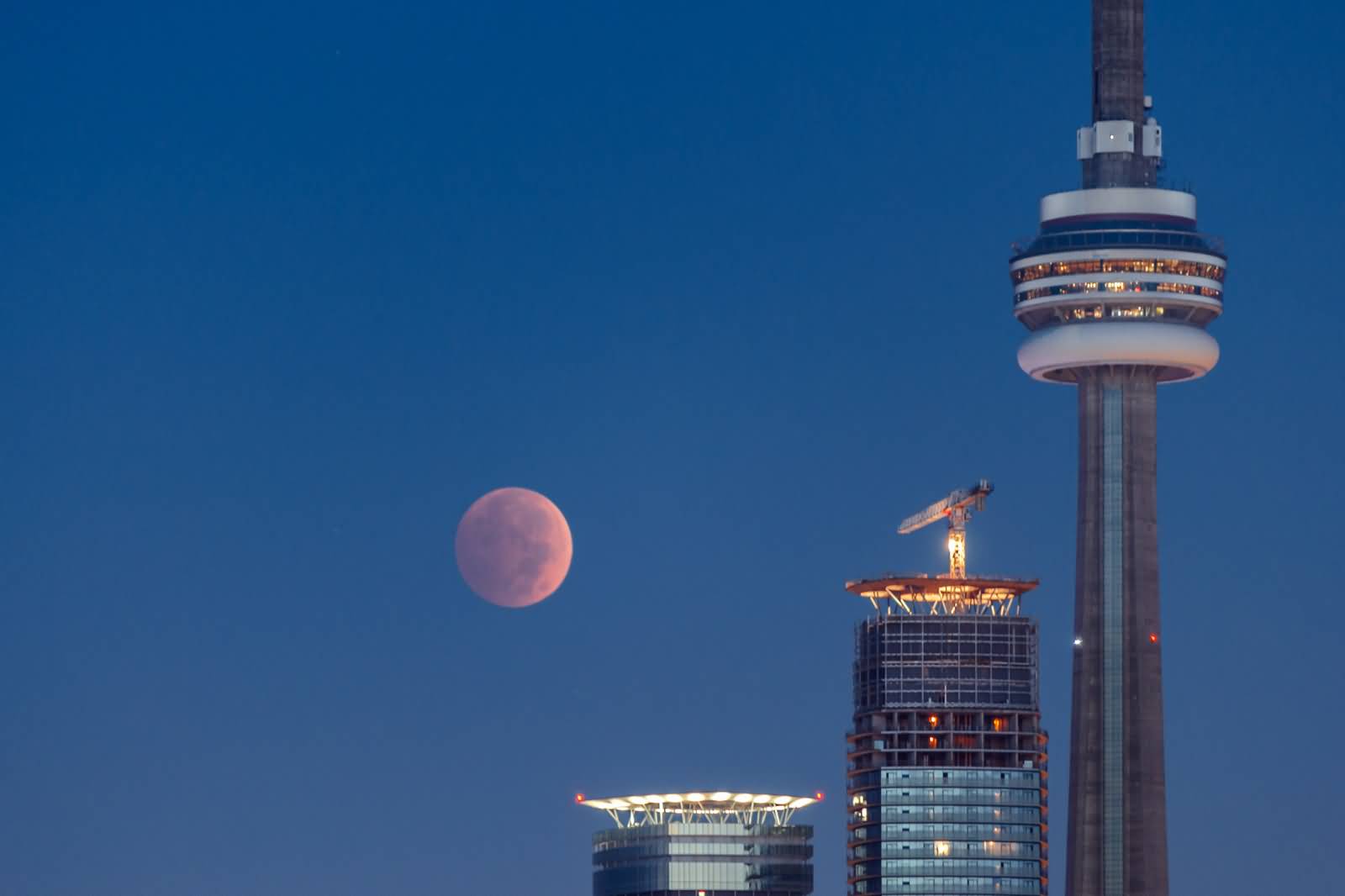 Full Moon And The CN Tower In Toronto