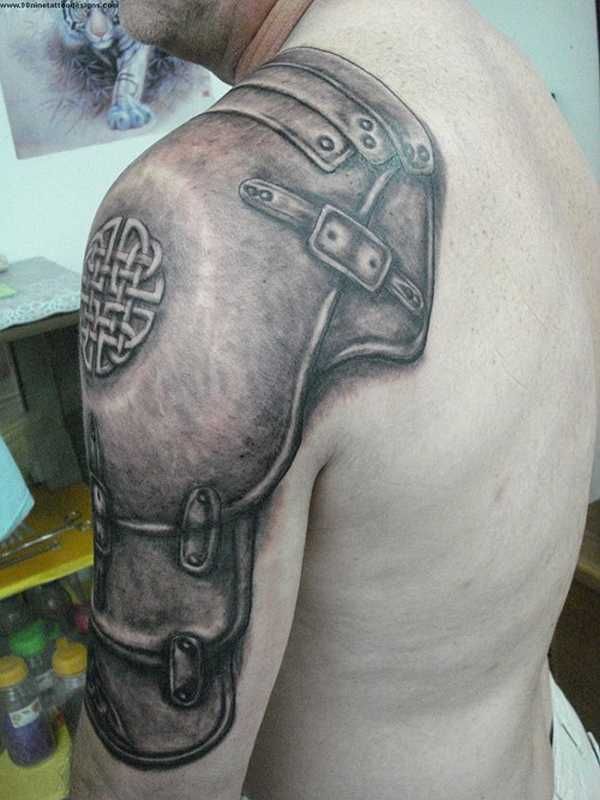 Grey Celtic Armor Tattoo On Upper Arm