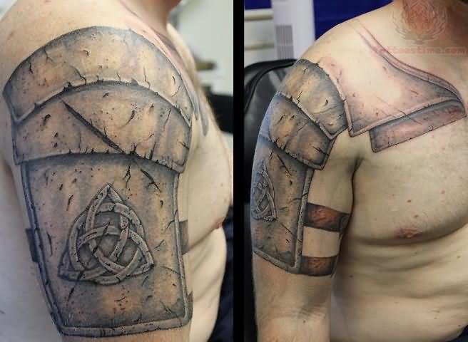 Grey Ink Celtic Armor Tattoo On Shoulder