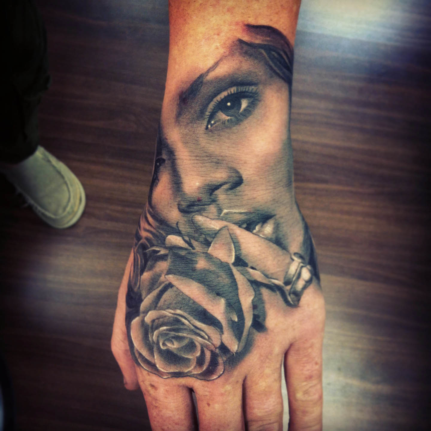 Grey Rose And Girl Head Tattoo On Left Hand