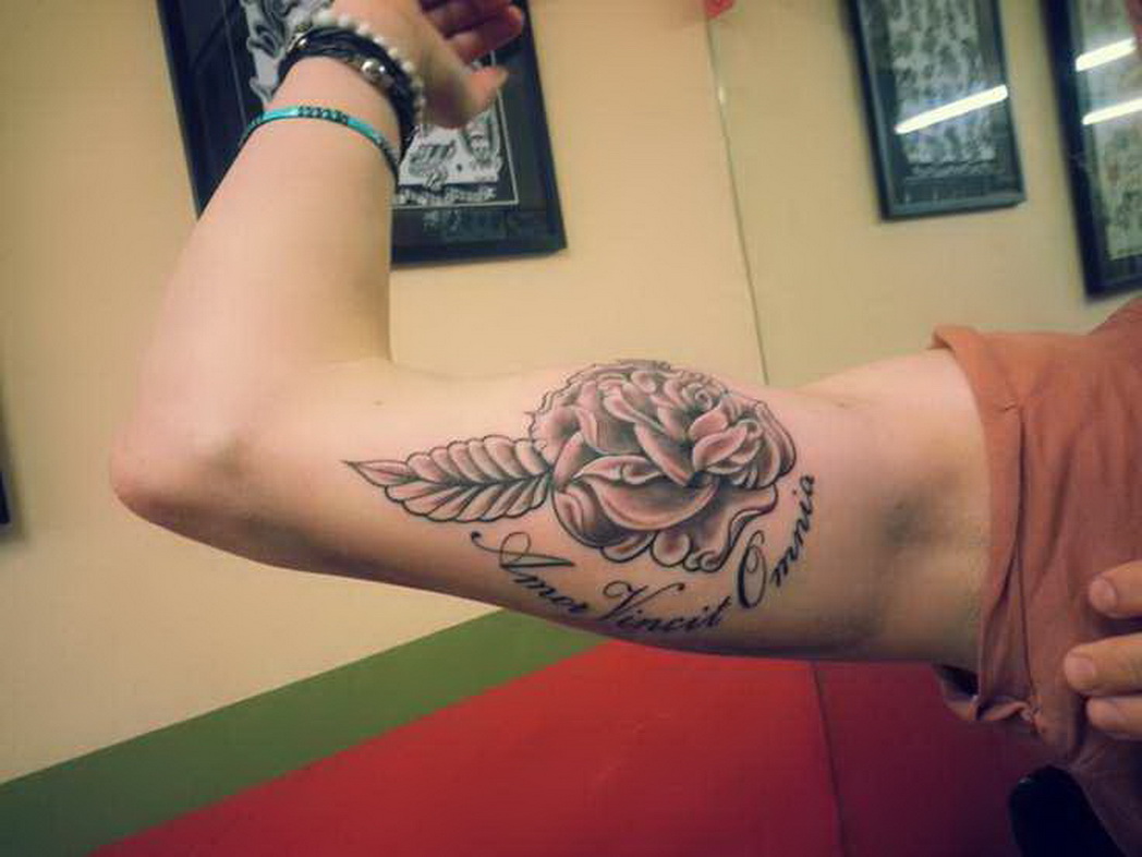 Grey Rose Tattoo On Inner Bicep by Ami James