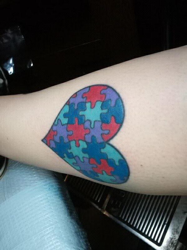 Heart With Autism Puzzle Pieces Tattoo On Forearm