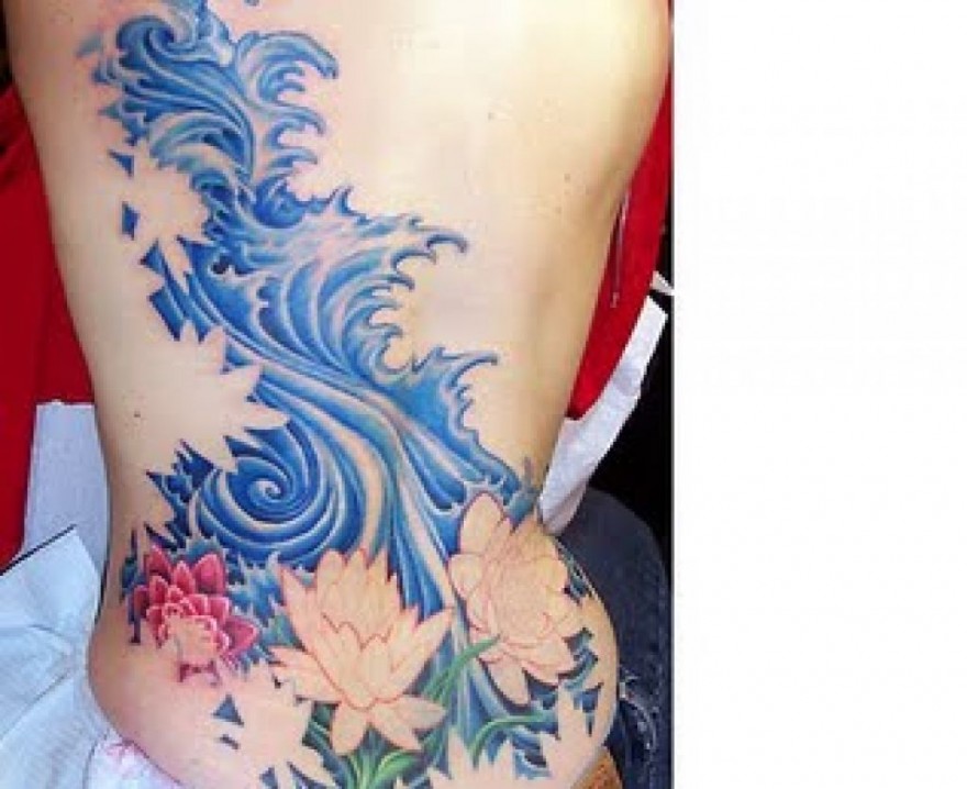 Japanese Water With Flowers Tattoo On Side Rib