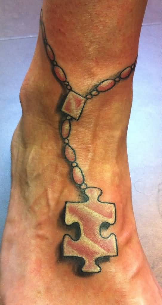 Jigsaw Puzzle Rosary Tattoo On Ankle