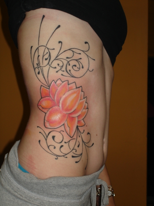 Lotus And Swirl Rib Cage Tattoo For Girls