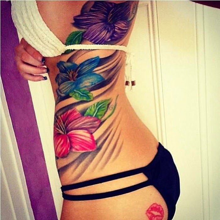 Lovely Flowers Tattoo On Girl Rib Cage