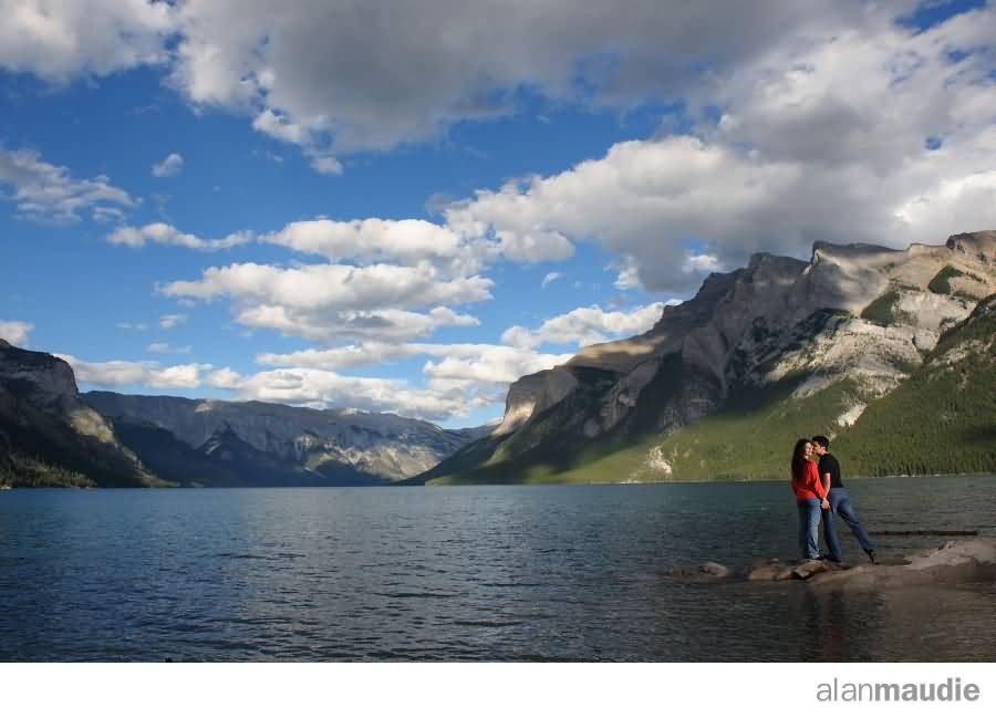 Loving Couple On The Bank Of Lake Louise