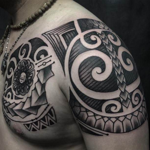 Maori Tattoo On Chest And Shoulder