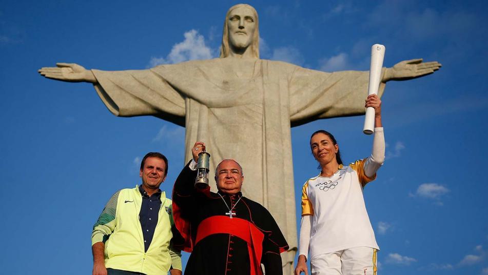 Mayor Paes, Archbishop Orani And Brazil's Olympian Isabel Barroso With Olympic Flame Visits Christ The Redeemer Statue