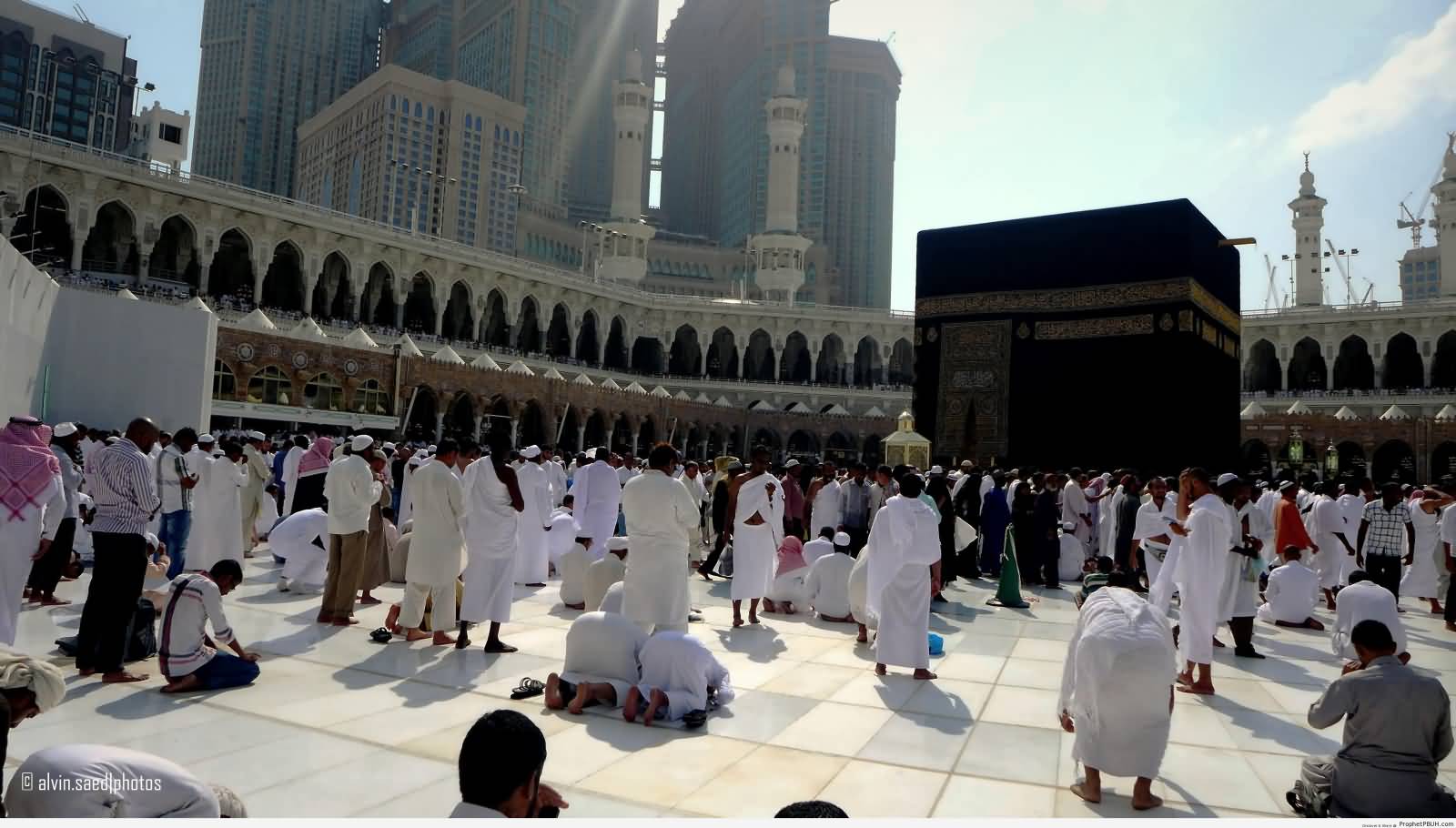 Men Praying At Al-Masjid al-Haram Courtyard