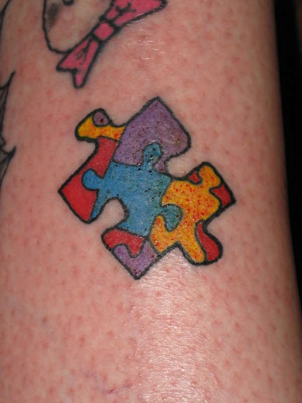 Missing Colorful Puzzle Piece Tattoo