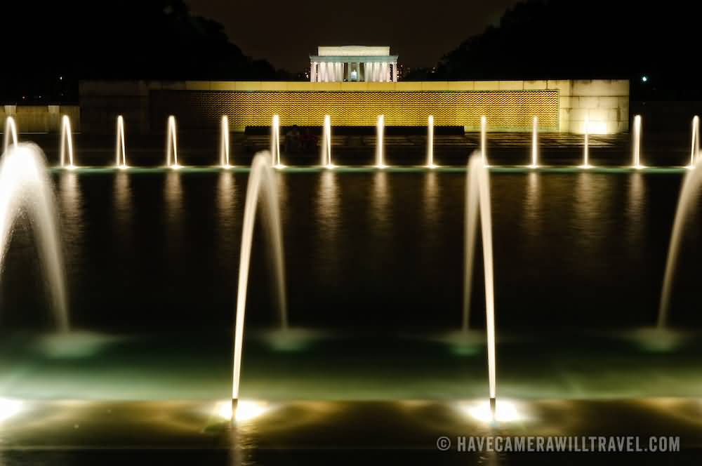 Night Shot Of The Fountains Of The National World War II Memorial With The Lincoln Memorial