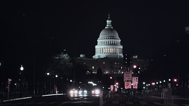 Night Time Traffic On Pennsylvania Avenue And Illuminated Dome Of United States Capitol Building