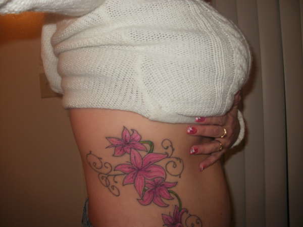 Pink Lily Flowers Tattoo On Rib Cage