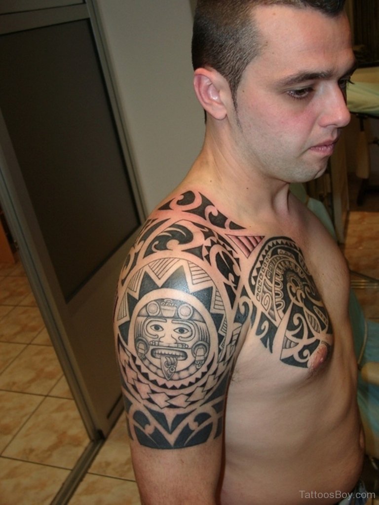 Pretty Maori Tribal Tattoo On Arm To Chest