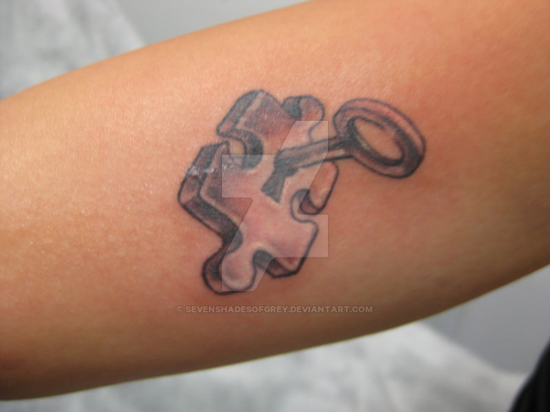 Puzzle Solution Tattoo On Arm By Sevenshadesofgrey