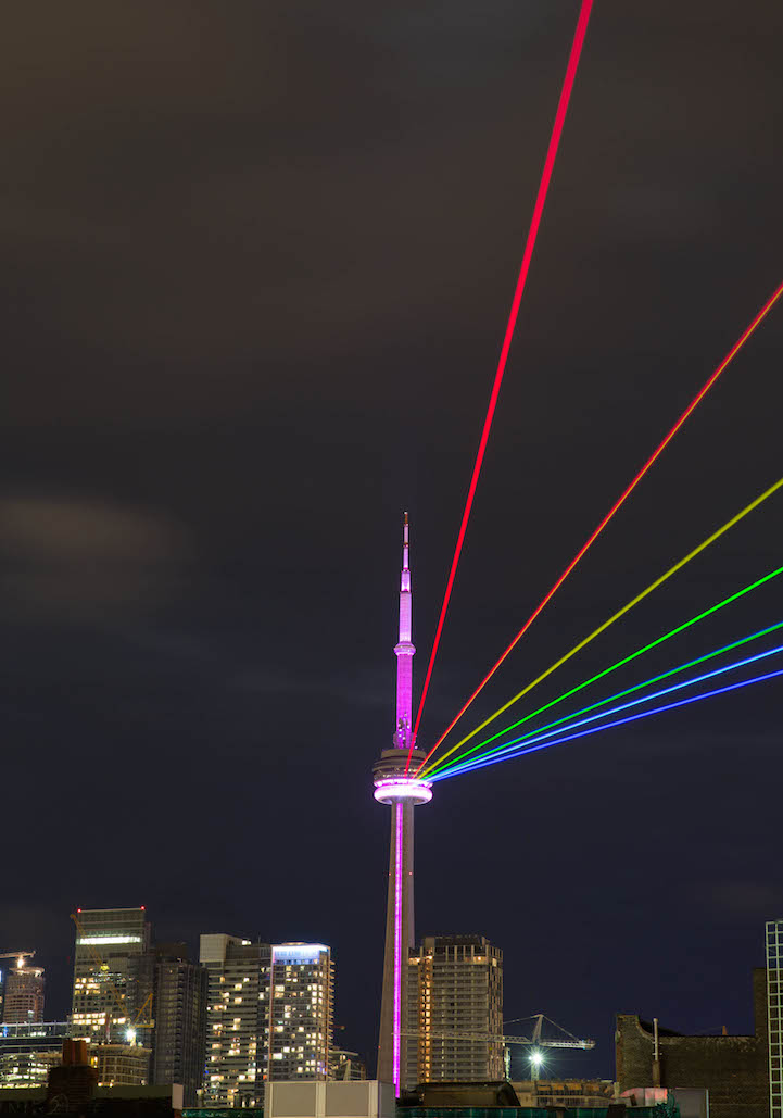 Rainbow Rays Coming Out Of CN Tower At Night